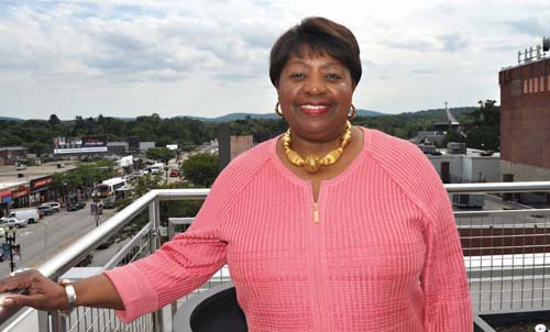 Dr. Azzie Young: Mattapan Community Health Center President and CEO Dr. Azzie Young on the third floor patio of the health center’s new home in Mattapan Square. TPhoto by Bill Forry